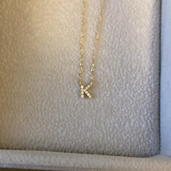 BONY LEVY “K” necklace pendant in pavé diamonds and 18-karat yellow gold.